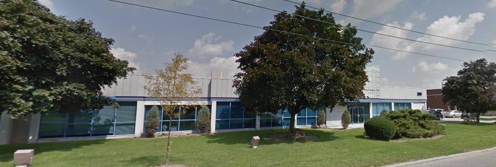 Front of the 300 Supertest Road building with mature trees and lawn